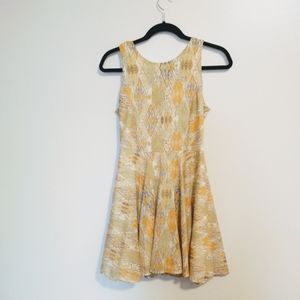 Dee Elle size small yellow and gold fit and flare dress. Lined, has some tanner